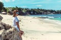 Beautiful young woman in sunglasses posing on the beach of a tropical island of Bali, Indonesia. Royalty Free Stock Photo