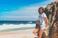 Beautiful young woman in sunglasses posing on the beach of a tropical island of Bali, Indonesia. Royalty Free Stock Photo