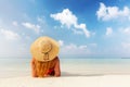 Beautiful young woman in sunhat lying relaxed on tropical beach in Maldives Royalty Free Stock Photo