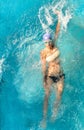 Beautiful young woman swimming in backstroke style Royalty Free Stock Photo
