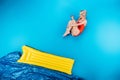 beautiful young woman in swimsuit jumping on inflatable mattress Royalty Free Stock Photo