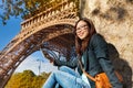 Beautiful young woman taking photo of Eiffel Tower Royalty Free Stock Photo