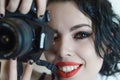 Beautiful young woman taking pictures with the camera close up Royalty Free Stock Photo
