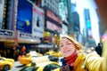 Beautiful young woman taking a selfie on Times Square, New York Royalty Free Stock Photo