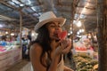 Beautiful Young Woman Tasting Watermelon On Traditional Street Market In Asia Girl Tourist Buying Fresh Fruits On Royalty Free Stock Photo