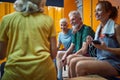 Beautiful young woman and three seniors in dressing room talking and relaxing after workout Royalty Free Stock Photo