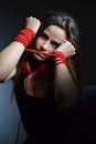 Beautiful young woman tied with the red rope Royalty Free Stock Photo