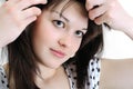 Beautiful young woman touching her hair Royalty Free Stock Photo