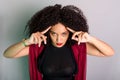 Beautiful young woman touching her hair with a red cloth Royalty Free Stock Photo