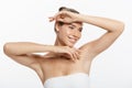 Beautiful Young Woman touching her skin. Beauty and Skin care concept. Royalty Free Stock Photo