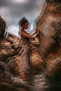 Beautiful young woman touching the rock with eyes closed. double exposure concept Royalty Free Stock Photo