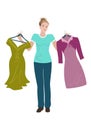 Beautiful young woman trying to choose between two dresses. Royalty Free Stock Photo