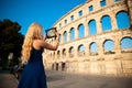 beautiful young woman turist taking photos of roman arena in Pula croatia Royalty Free Stock Photo