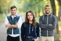 Beautiful young woman and two men behind her Royalty Free Stock Photo