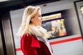 Beautiful young woman at the underground platform, waiting Royalty Free Stock Photo