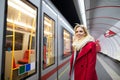 Beautiful young woman at the underground platform, waiting Royalty Free Stock Photo