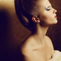 Beautiful young woman undressed holding furs Royalty Free Stock Photo