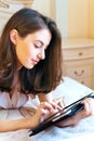 Beautiful young woman using digital tablet computer Royalty Free Stock Photo