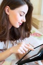 Beautiful young woman using digital tablet computer Royalty Free Stock Photo