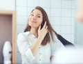 Beautiful young woman  using hair dryer drying hair. Hair care Royalty Free Stock Photo