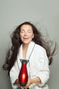 Beautiful woman using hairdryer Royalty Free Stock Photo