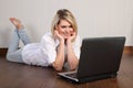 Beautiful young woman using internet at home Royalty Free Stock Photo