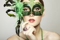 The beautiful young woman in a venetian mask