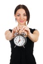 Beautiful young woman with vintage alarm clock