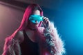 Beautiful young woman in virtual reality, the cyberpunk style, neon light, VR concept Royalty Free Stock Photo