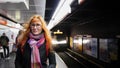 Beautiful young woman waiting subway at underground - train arrives Royalty Free Stock Photo