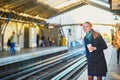 Beautiful young woman waiting for a train Royalty Free Stock Photo