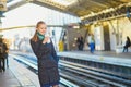 Beautiful young woman waiting for a train in Parisian underground Royalty Free Stock Photo