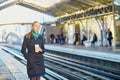 Beautiful young woman waiting for a train in Parisian underground Royalty Free Stock Photo