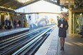 Beautiful young woman waiting for a train in Parisian underground Royalty Free Stock Photo