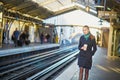 Beautiful young woman waiting for a train in Parisian underground Royalty Free Stock Photo