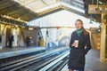 Beautiful young woman waiting for a train in Parisian underground Royalty Free Stock Photo