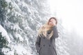 Beautiful young woman on a walk in winter nature Royalty Free Stock Photo