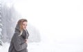 Beautiful young woman on a walk in winter nature Royalty Free Stock Photo