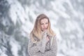 Beautiful young woman on a walk in winter nature Royalty Free Stock Photo