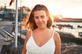 Beautiful young woman walking on beach promenade enjoying ocean view smiling happy on summer vacation Royalty Free Stock Photo