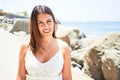 Beautiful young woman walking on beach promenade enjoying ocean view smiling happy on summer vacation Royalty Free Stock Photo