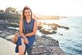 Beautiful young woman walking on beach promenade enjoying ocean view smiling happy on summer vacation Royalty Free Stock Photo