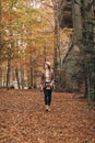 Beautiful young woman walking charming autumn forest Royalty Free Stock Photo