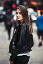 Beautiful young woman walking on the crowdy street Royalty Free Stock Photo