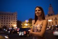 Beautiful woman is walking in the night city. Royalty Free Stock Photo