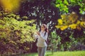 Beautiful young woman walking at public park in the morning,Happy and smiling,Relaxing time,Positive thinking Royalty Free Stock Photo