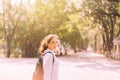 Beautiful young woman walking at public park in the morning,Happy and smiling,Relaxing time,Positive thinking Royalty Free Stock Photo