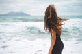 Beautiful young woman walking at the sea Royalty Free Stock Photo