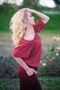 Beautiful young woman walking in a summer park Royalty Free Stock Photo