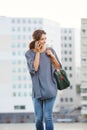 Beautiful young woman walking and talking on cell phone Royalty Free Stock Photo